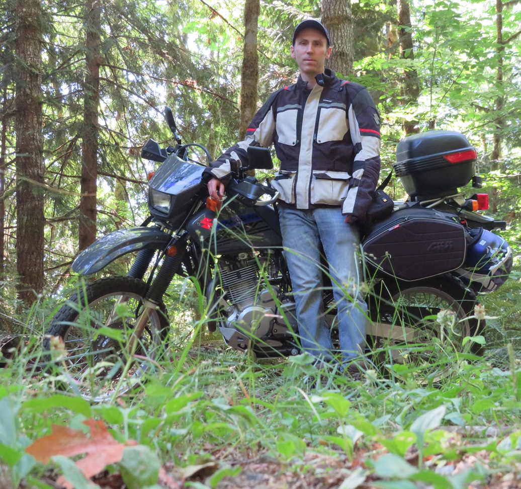Editor of Eflora.info on a motorcycle in the forest